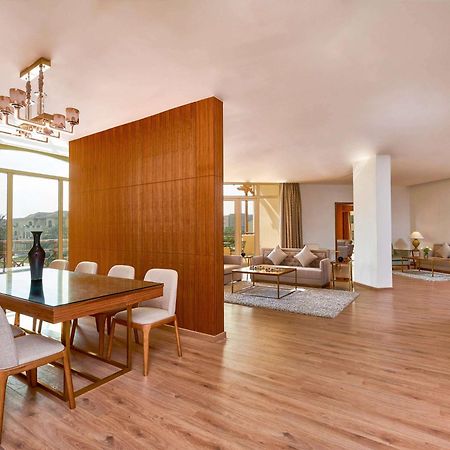 Moevenpick Hotel Cairo - Media City Giza Exteriér fotografie A 3D rendering of a living room